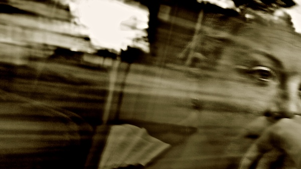 Med thumb looking out window