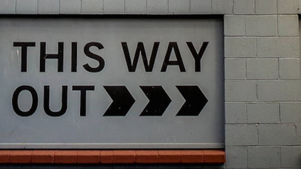 Med thumb this way out sign